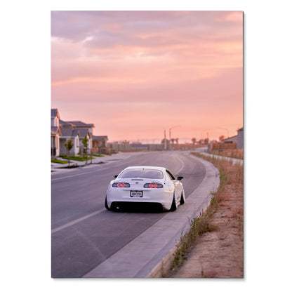 White Toyota Supra MK4 driving on suburban road at pink sunset sky poster wall art.