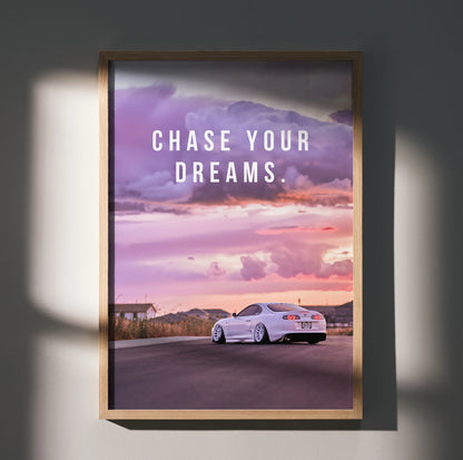 Motivational poster wall art featuring white Toyota Supra Mk4 on road at sunset with "Chase Your Dreams" text.