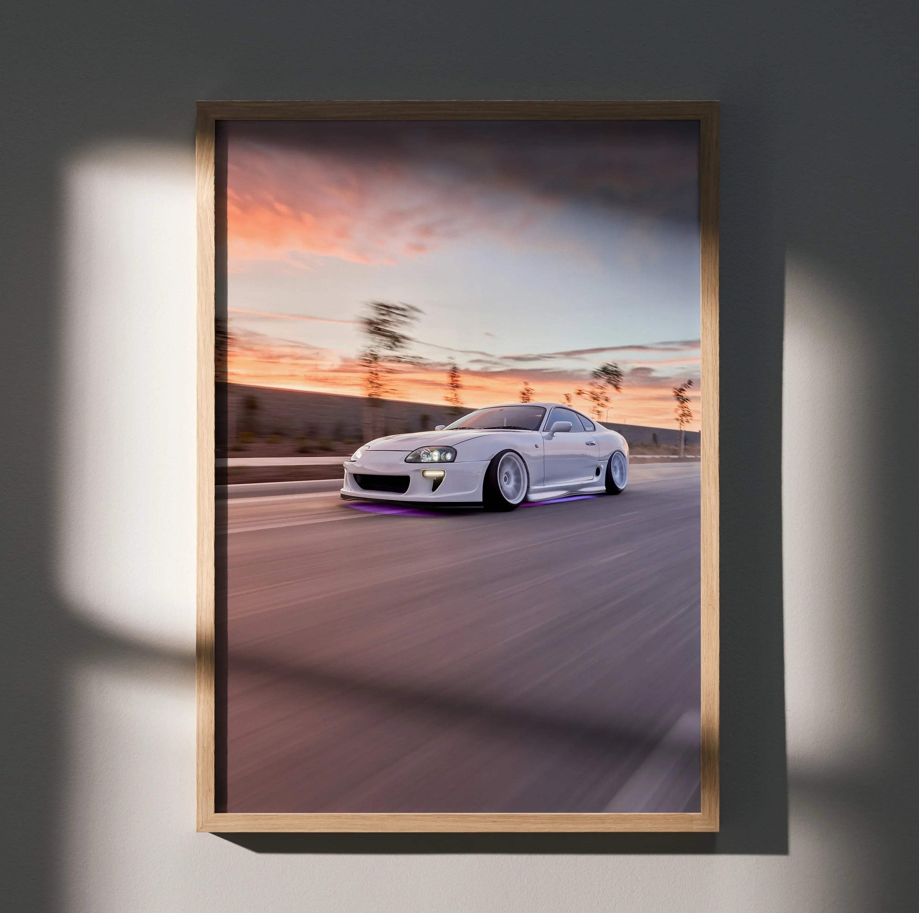 Toyota Supra MK4 speeding on road poster in wooden frame with sunset background wall art.