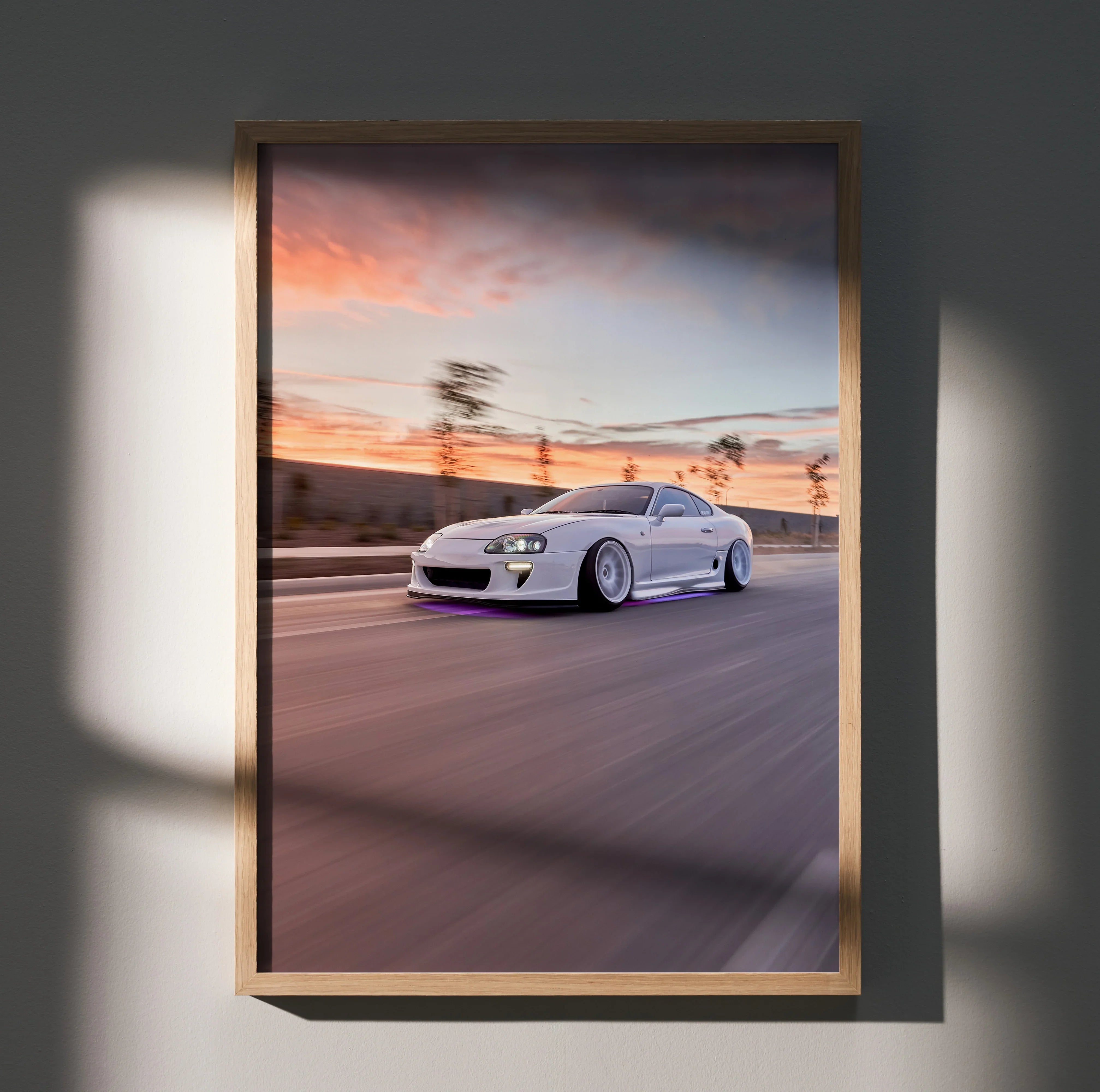 Toyota Supra MK4 speeding on road poster in wooden frame with sunset background wall art.