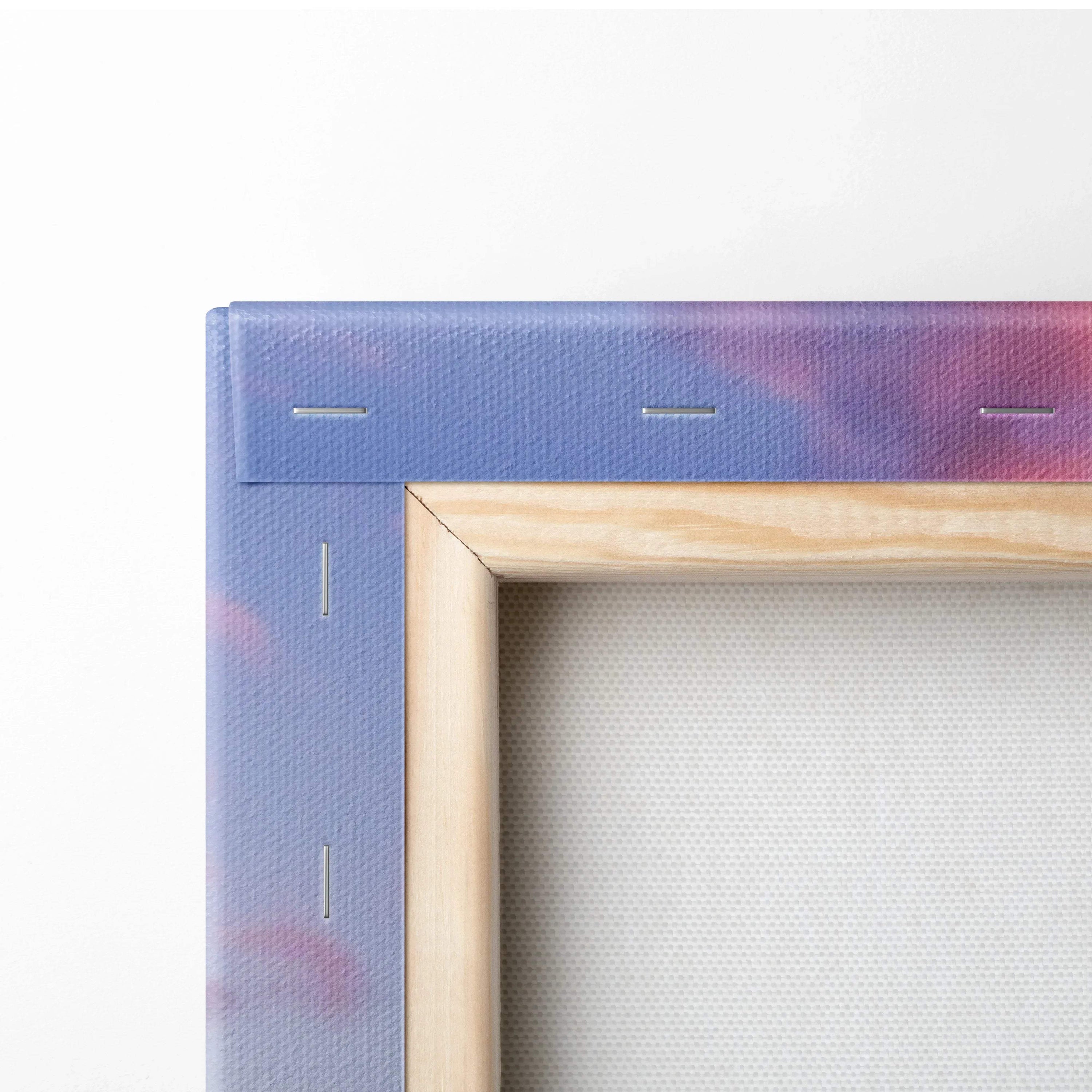 Close-up of stretched canvas wall art showing wooden frame and stapled fabric backing.