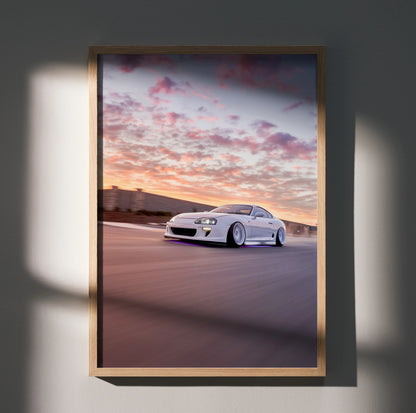 Toyota Supra MK4 speeding at sunset with vibrant sky tones, automotive poster wall art.