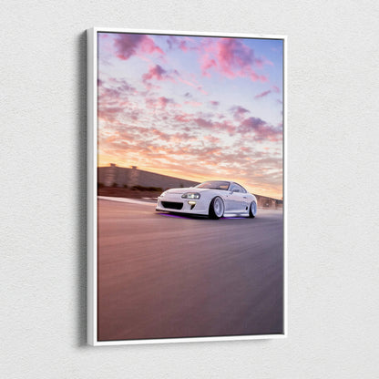 Toyota Supra MK4 speeding at sunset canvas wall art with vibrant sky and motion blur.