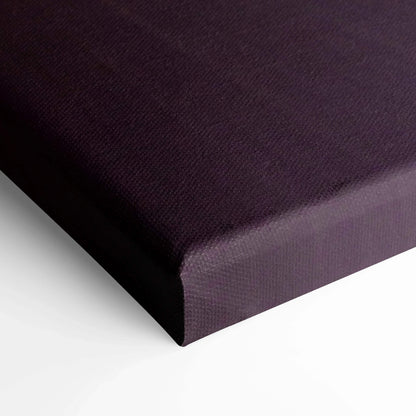 Close-up of black stretched canvas corner for wall art print with textured surface.