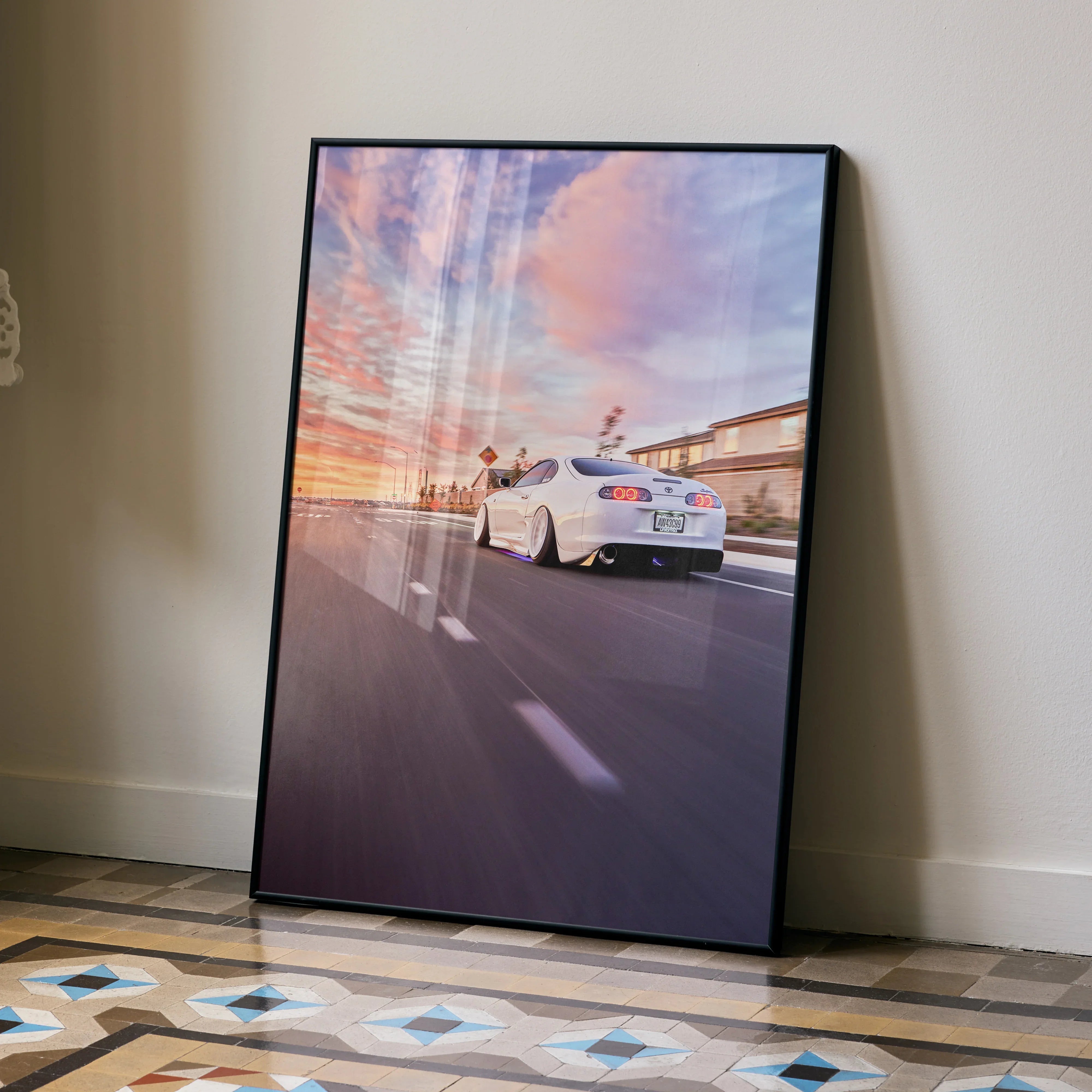 Toyota Supra MK4 on road at sunset wall art poster with vibrant sky colors.