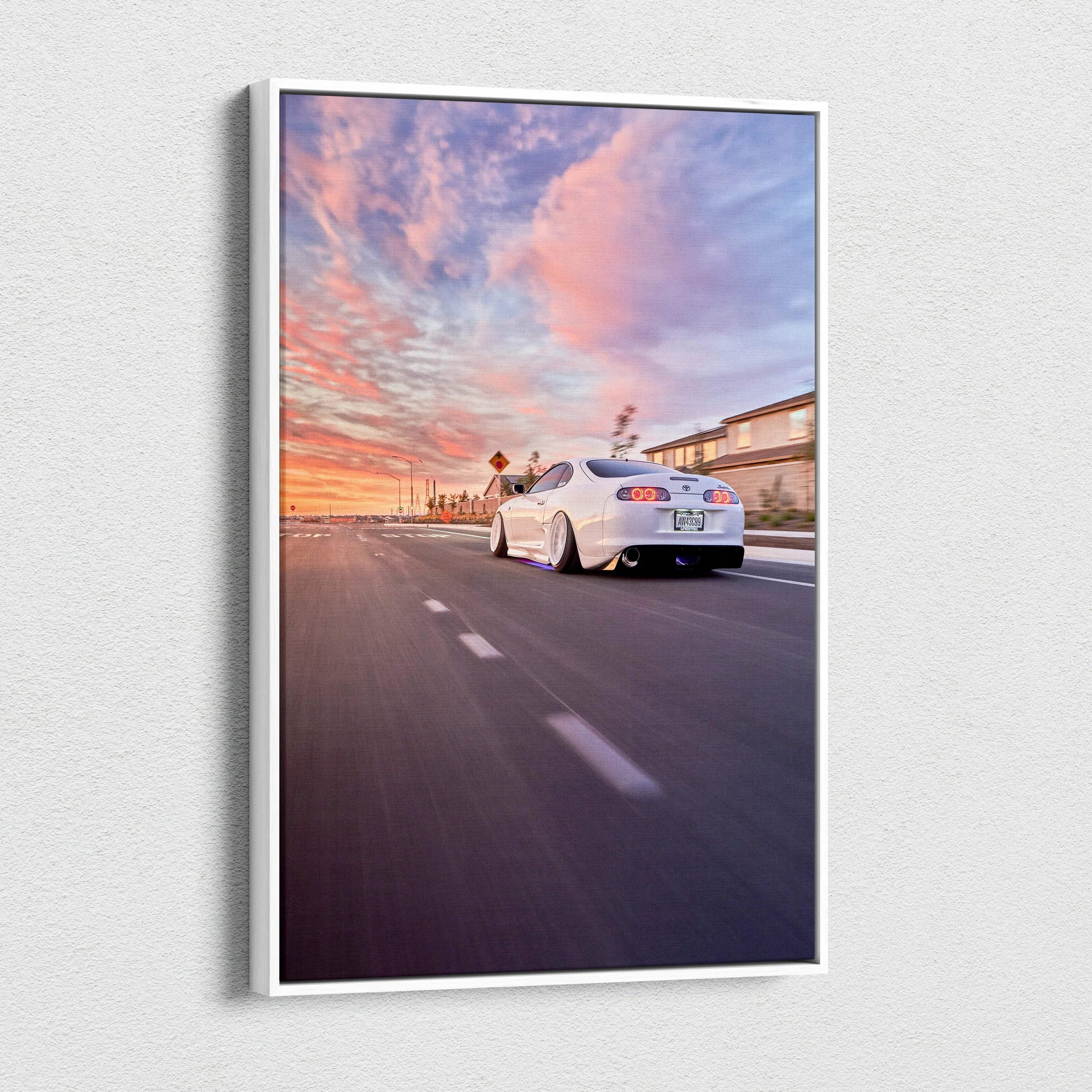 Toyota Supra MK4 driving at sunset with vibrant sky, vertical canvas wall art print.