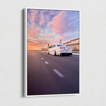 Toyota Supra MK4 driving at sunset with vibrant sky, vertical canvas wall art print.