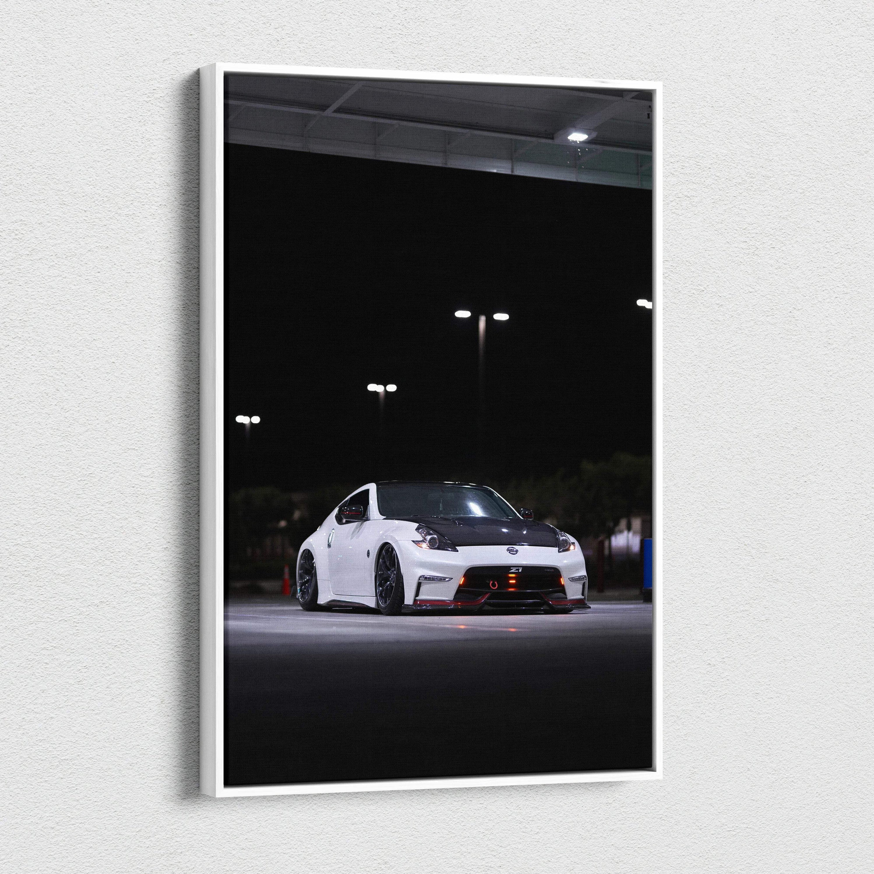 Vertical canvas art of a white Nissan 370z car in a dark parking lot, modern wall art decor.