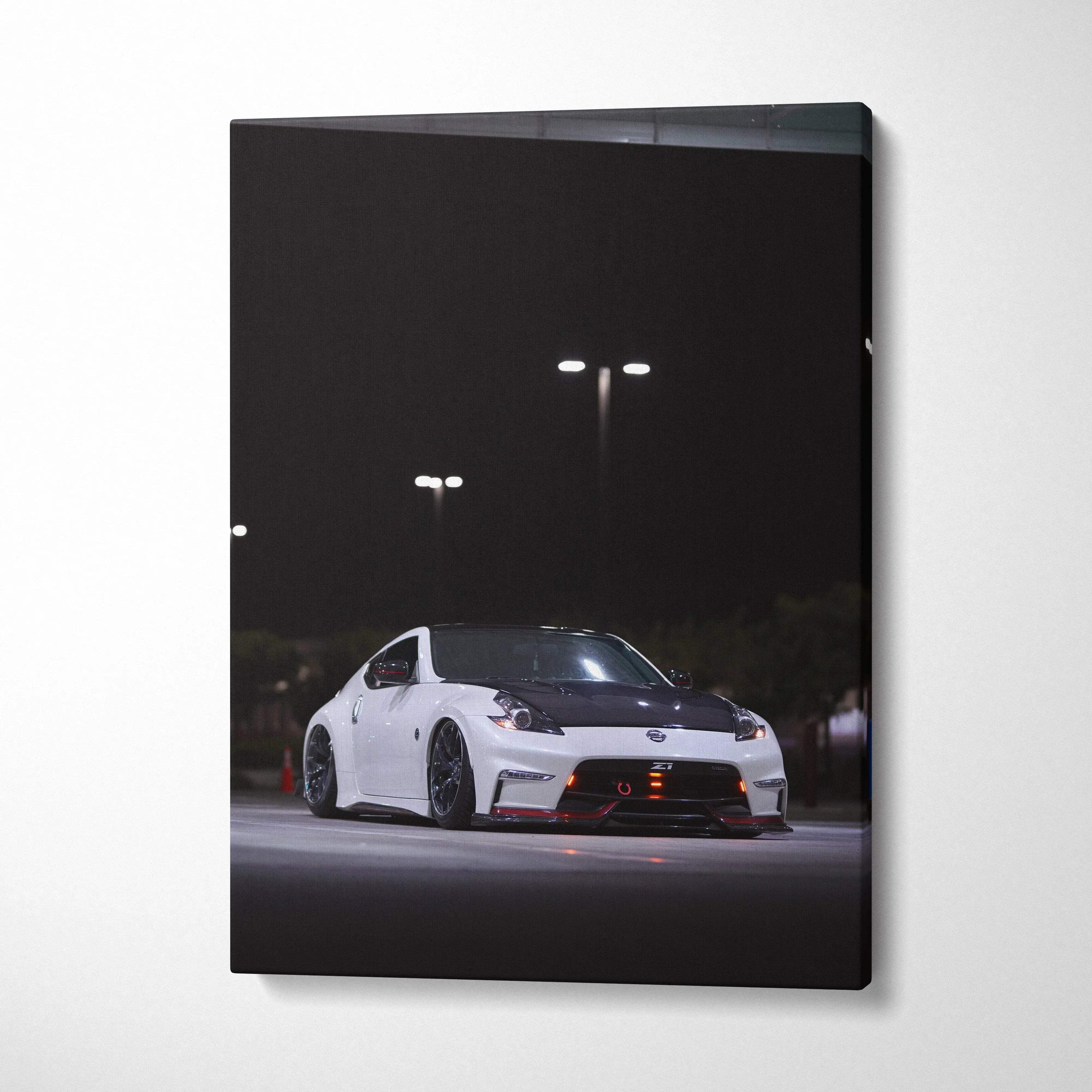 White Nissan 370z sports car at night with streetlights, vertical canvas wall art.