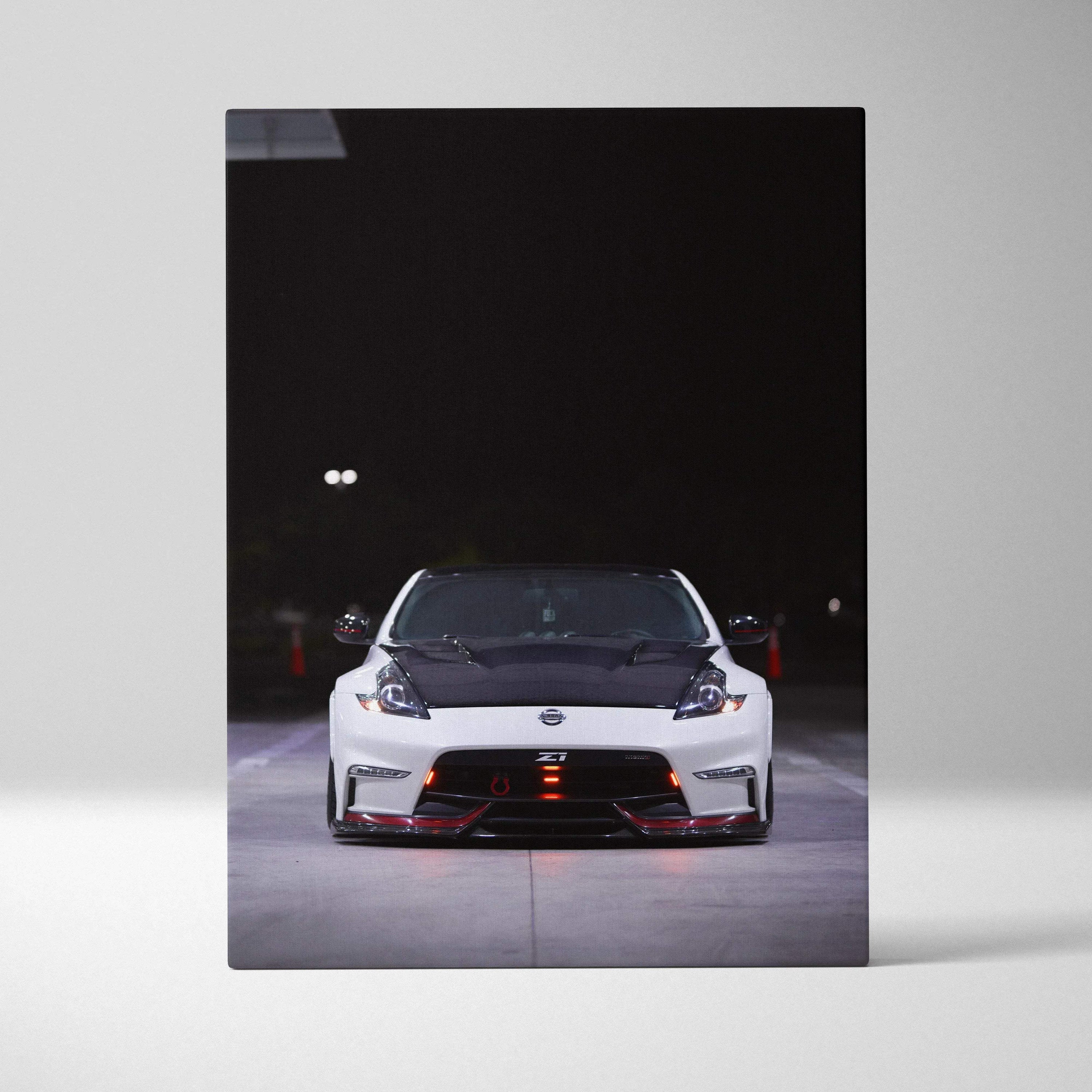 Nissan 370z front view on vertical canvas wall art with black background and red accents.