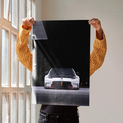 Nissan 370z poster featuring front view of white sports car on black background wall art.