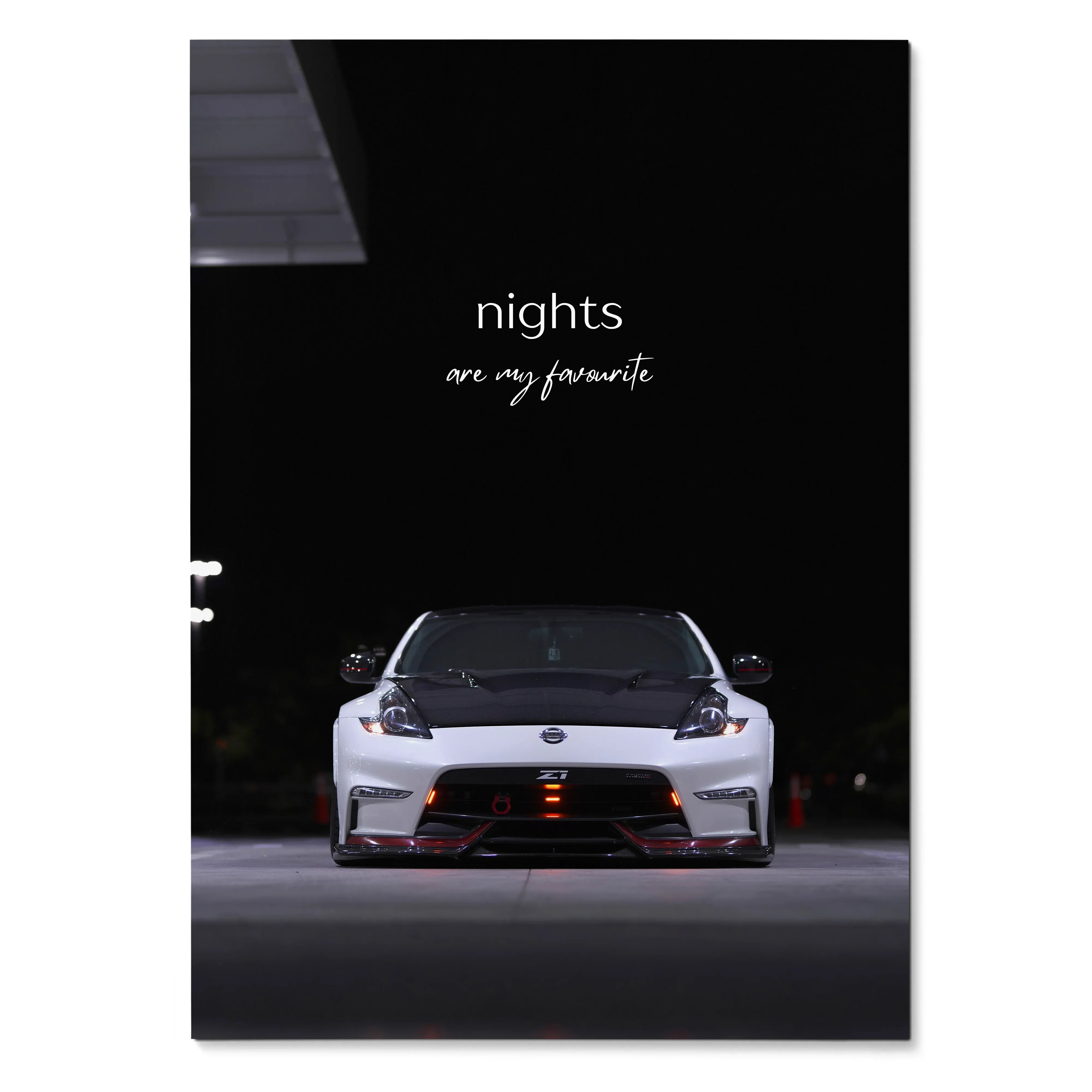 Nissan 370z front view at night with "nights are my favorite" text motivational poster wall art.