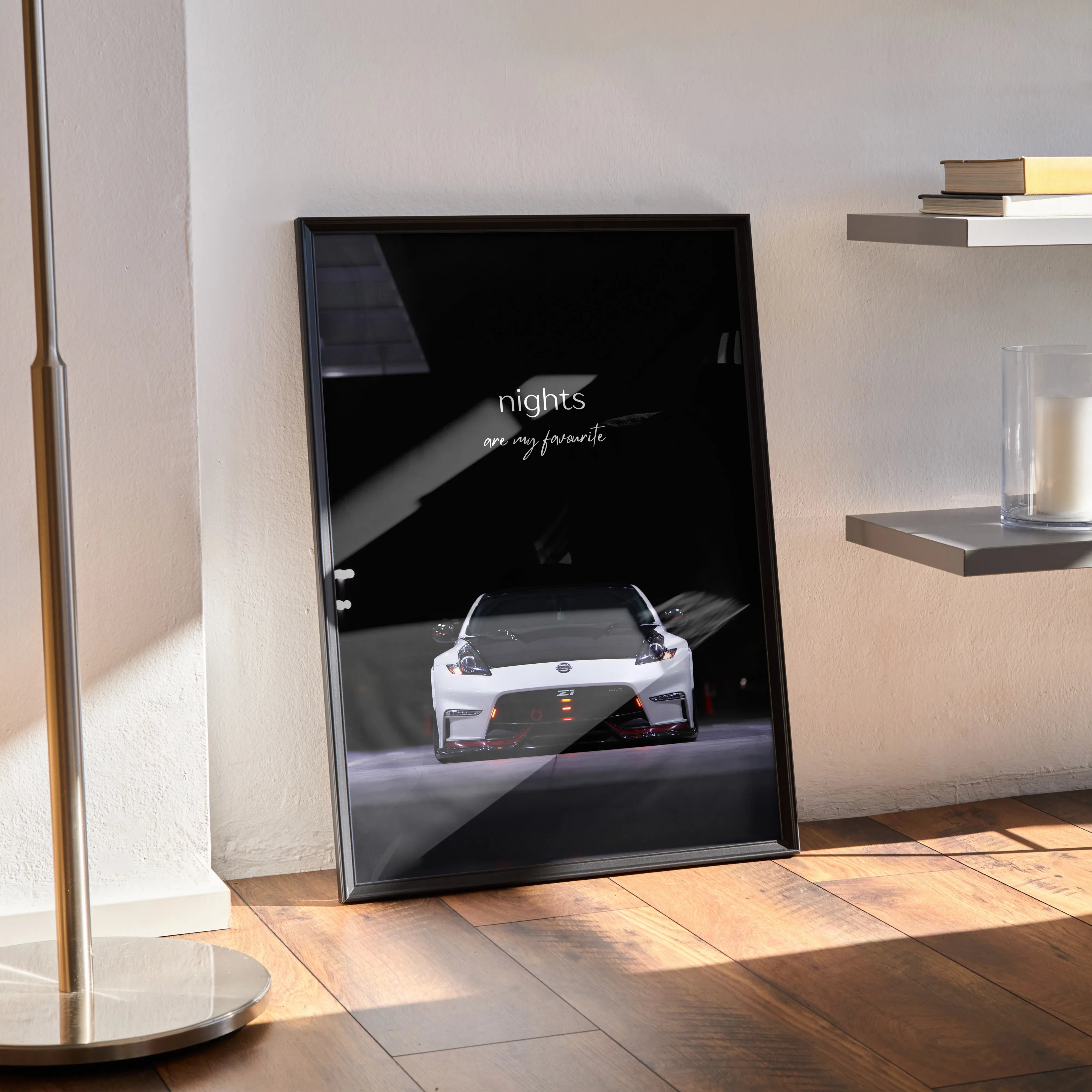 Black motivational poster wall art featuring a white Nissan 370z with inspiring script text.