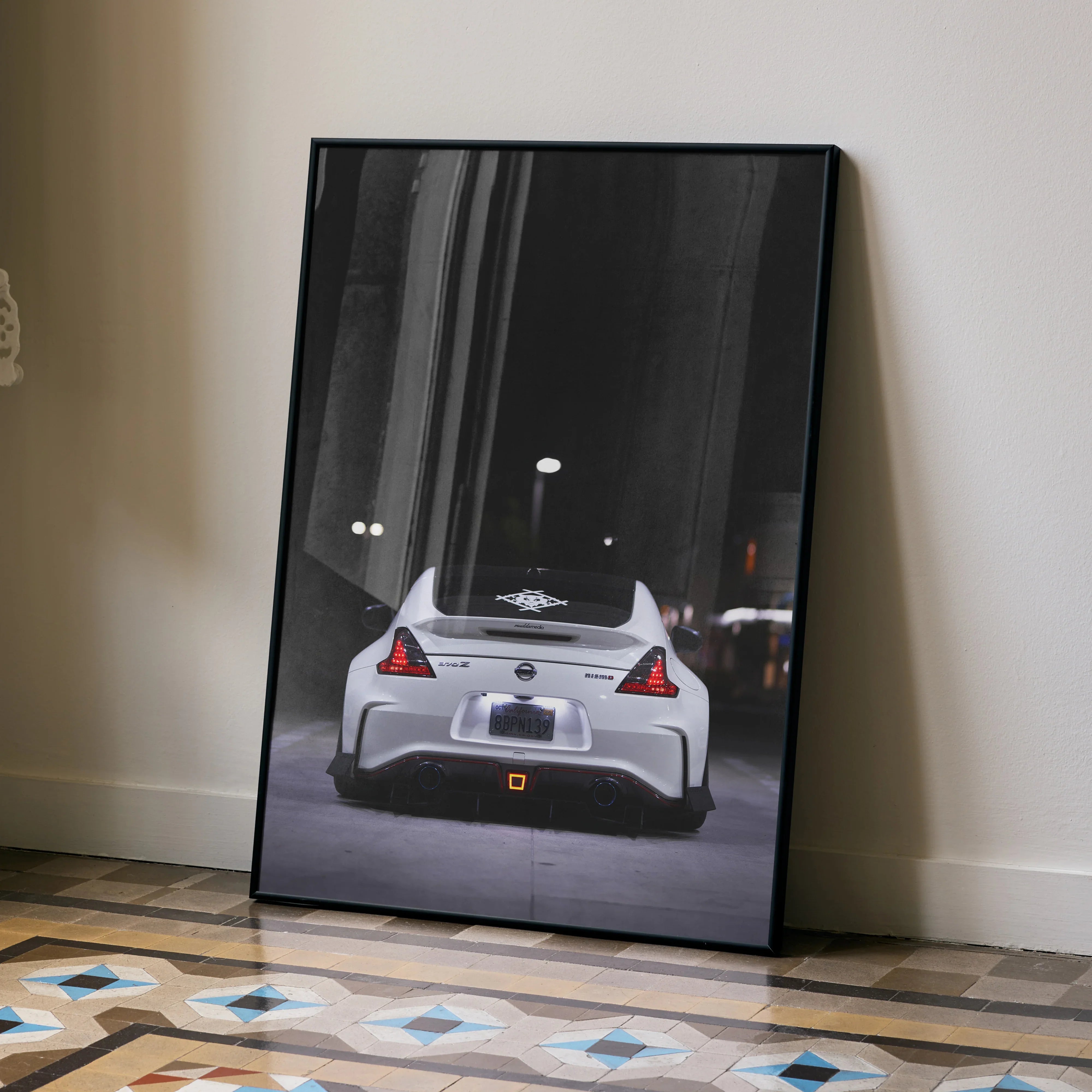Nissan 370z rear view poster wall art with sleek white sports car on city street at night.