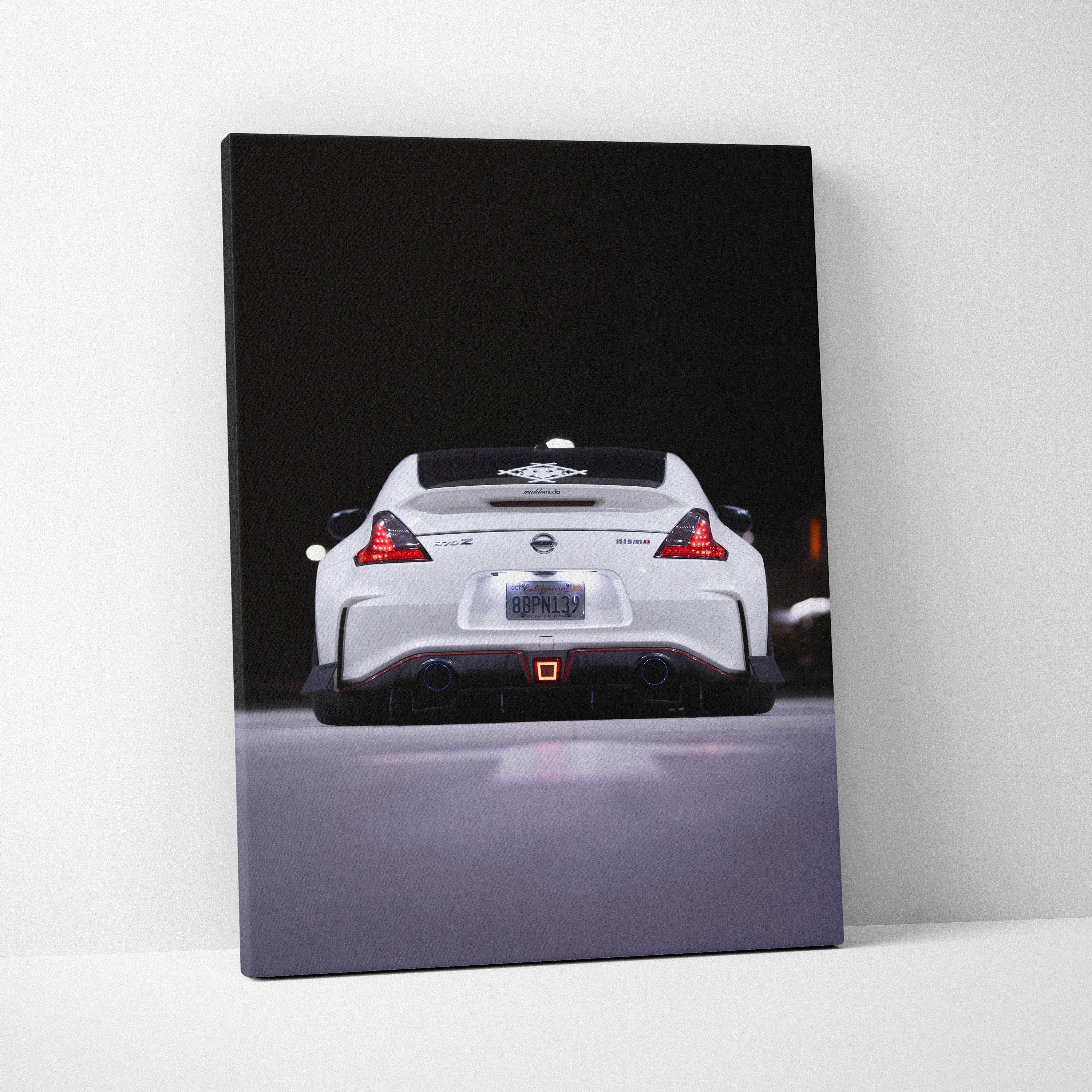 White Nissan 370z rear view on black background canvas wall art print.