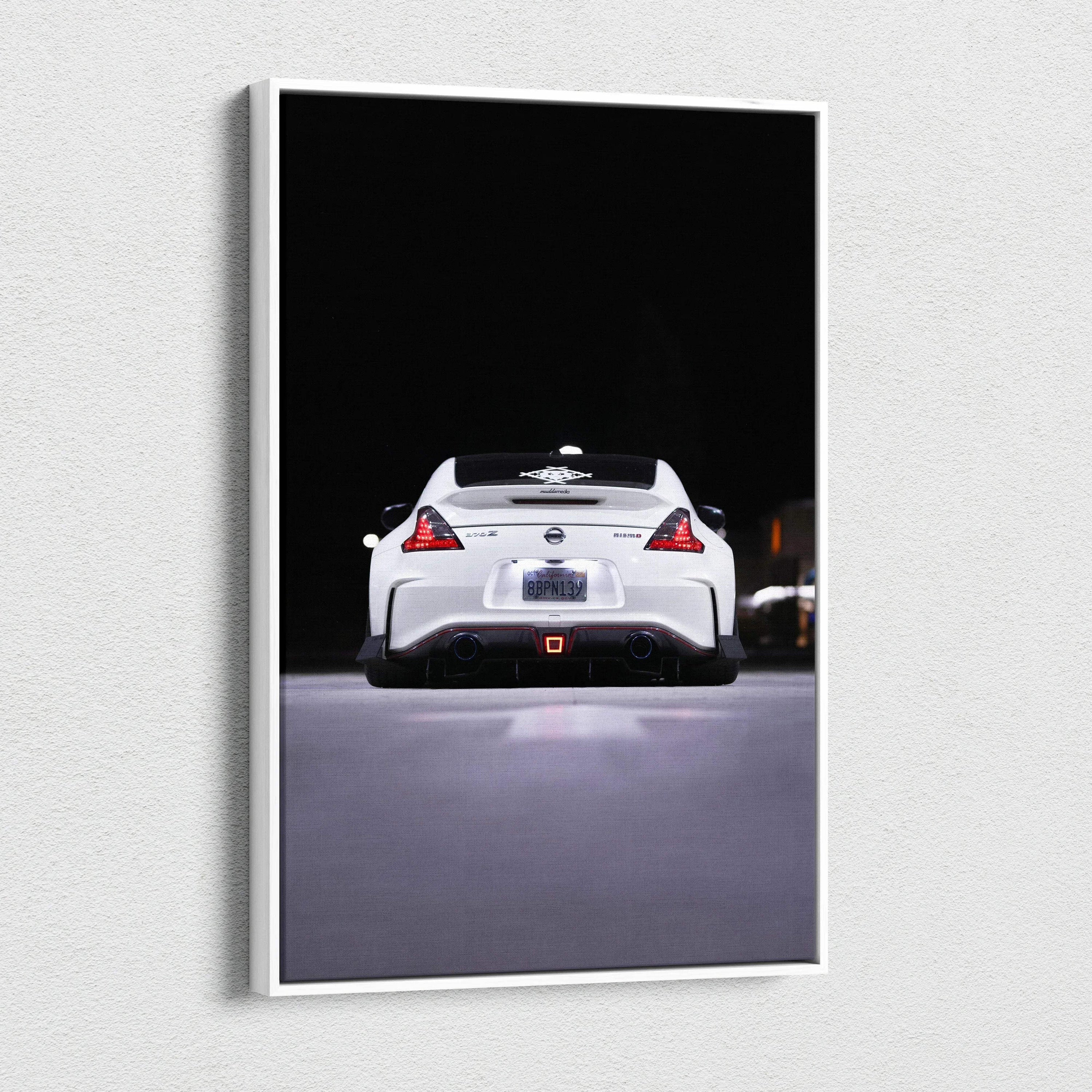Vertical canvas art featuring a white Nissan 370z rear view against a black background, wall art print.