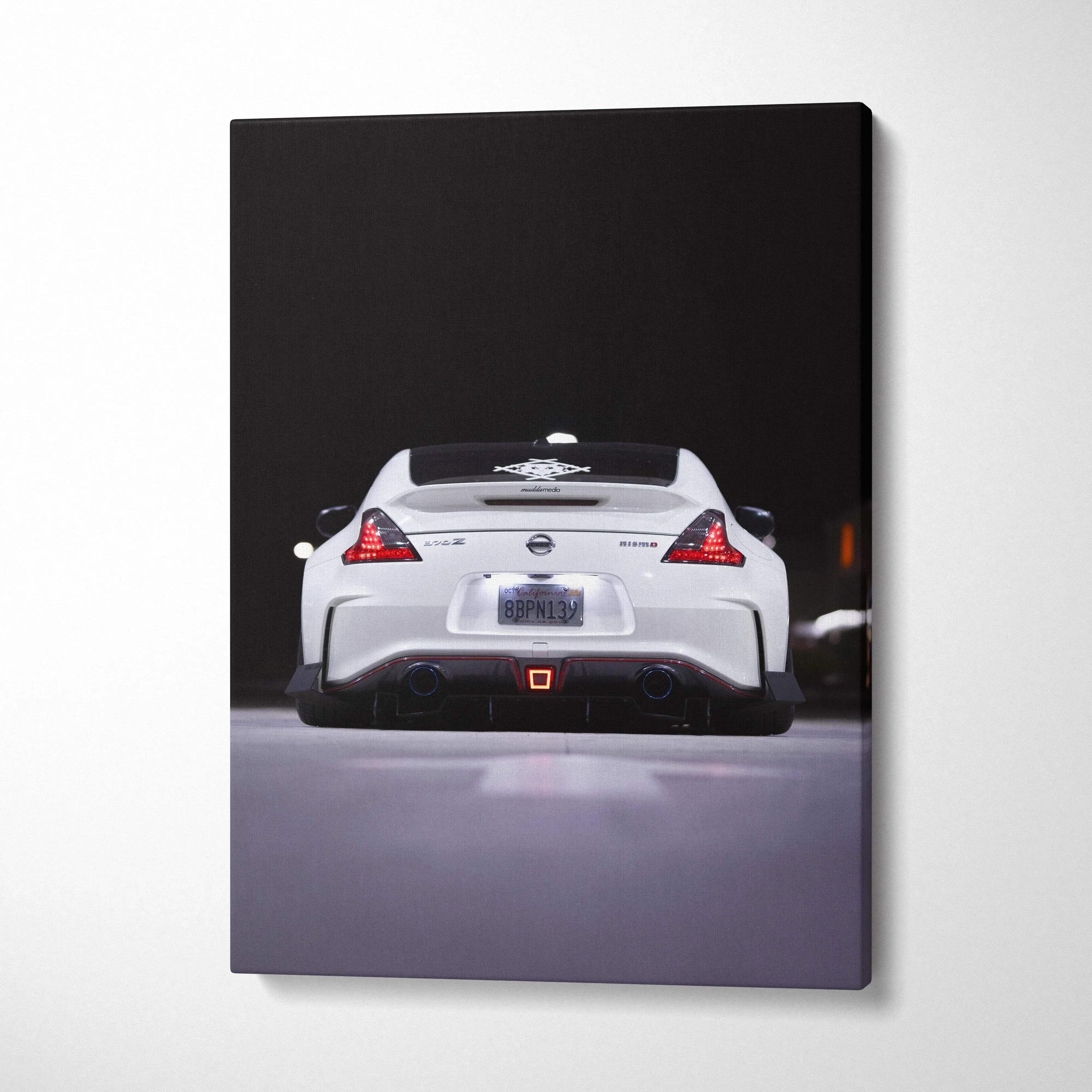 White Nissan 370z rear view on vertical black background canvas wall art.