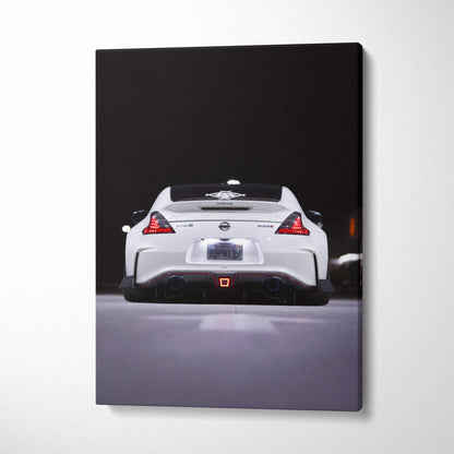 White Nissan 370z rear view on vertical black background canvas wall art.