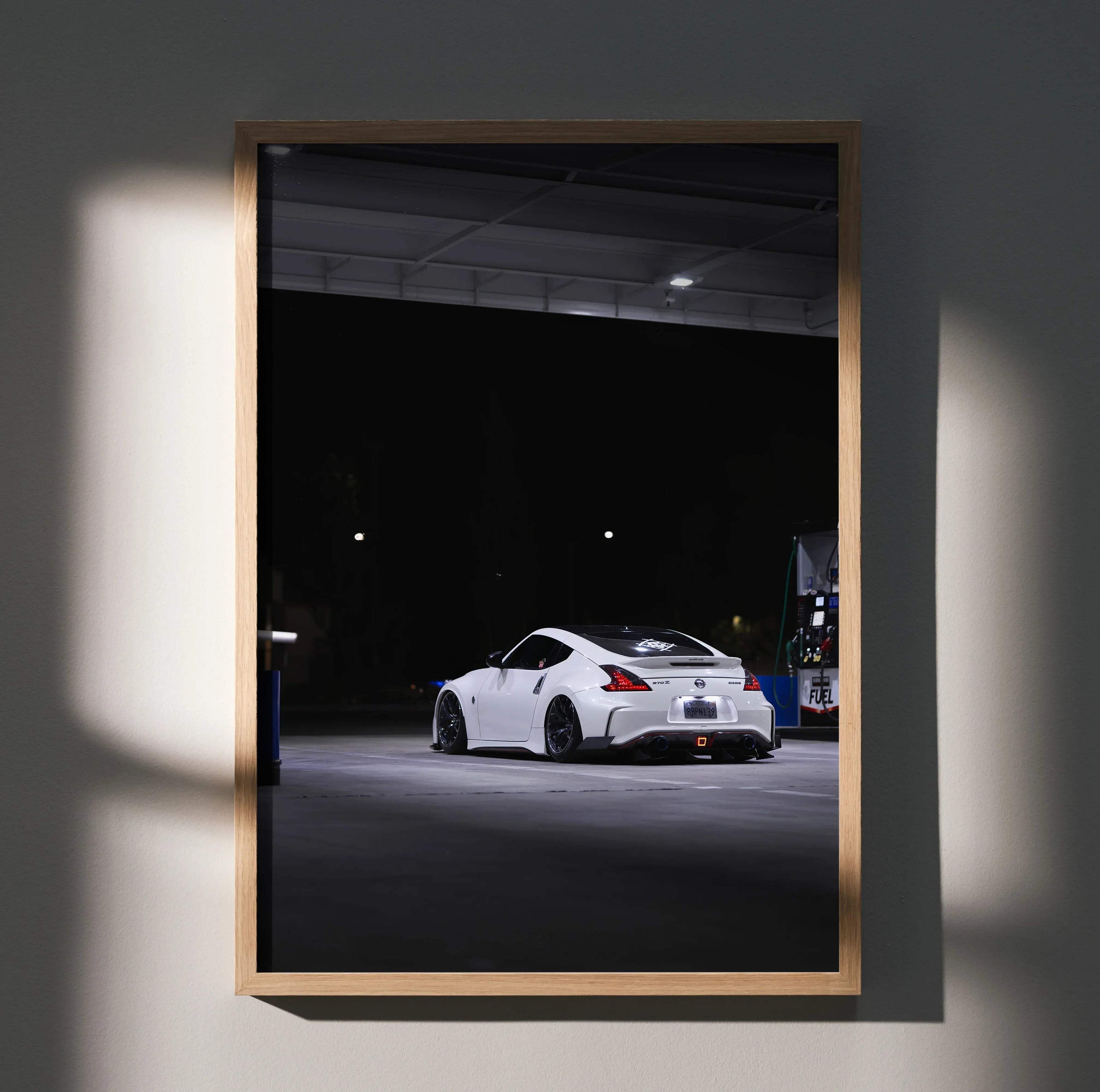 White Nissan Z34 370z sports car at night in garage, high-resolution poster wall art.
