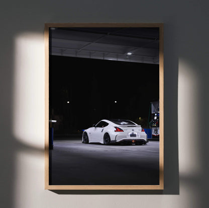 White Nissan Z34 370z sports car at night in garage, high-resolution poster wall art.