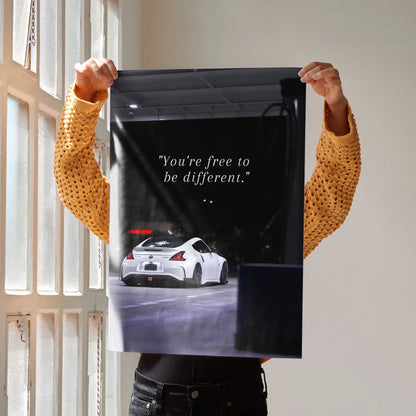 Motivational poster with white Nissan 370z and inspiring text on black background wall art.