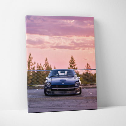 Nissan 240z canvas art with vintage car front view against pink sunset sky, vertical wall art.