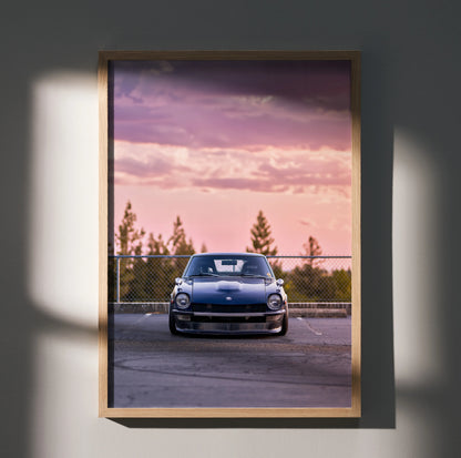 Nissan 240z poster wall art with car at sunset and pine trees background in wooden frame.