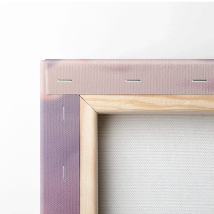 Corner detail of stretched canvas with light wooden frame showing staple-secured fabric for wall art.
