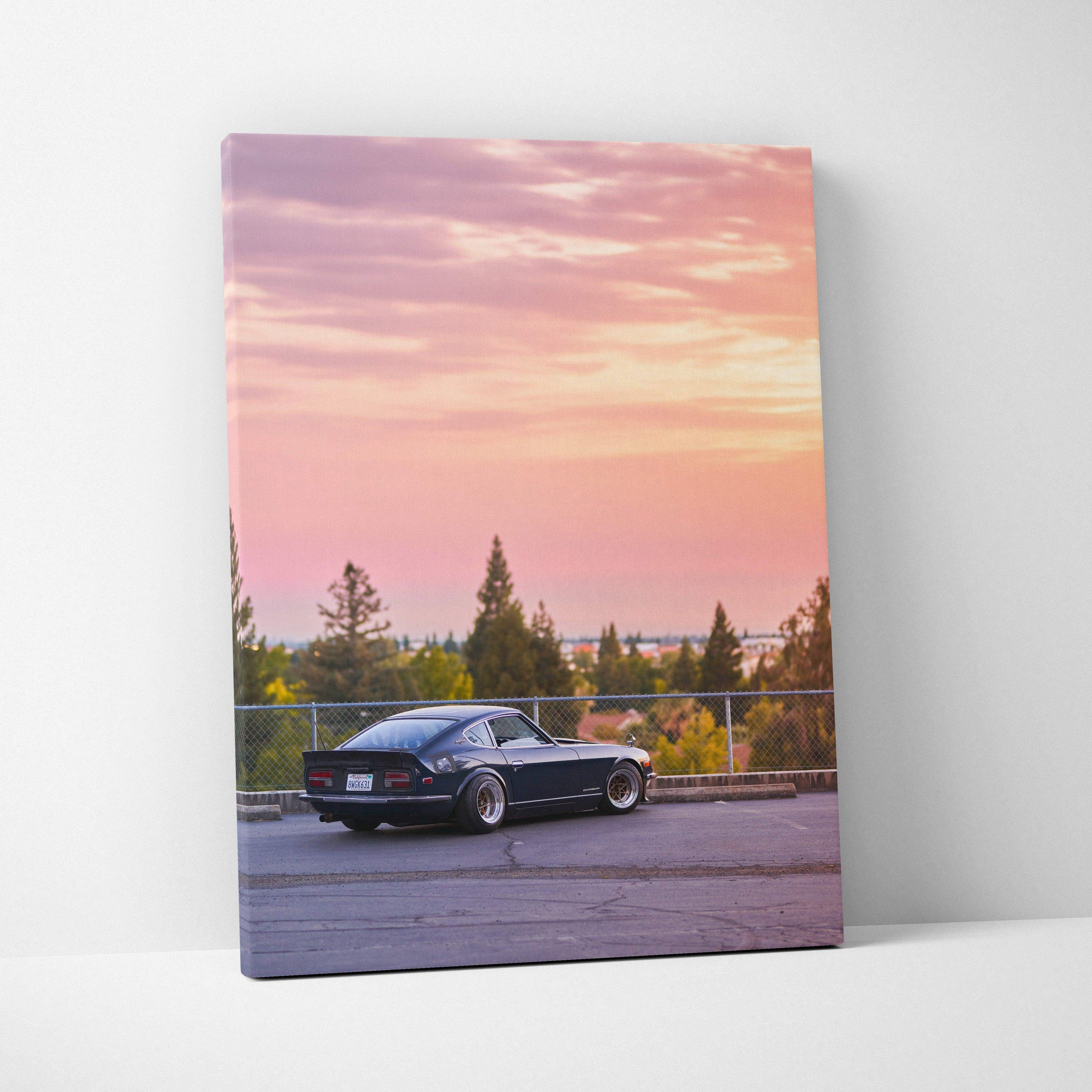 Nissan 240z car at sunset on vertical canvas wall art with vibrant pink and orange sky.