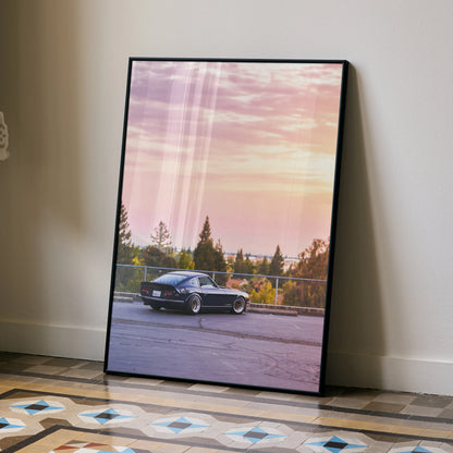 Nissan 240z vintage car poster with sunset background wall art in black frame.