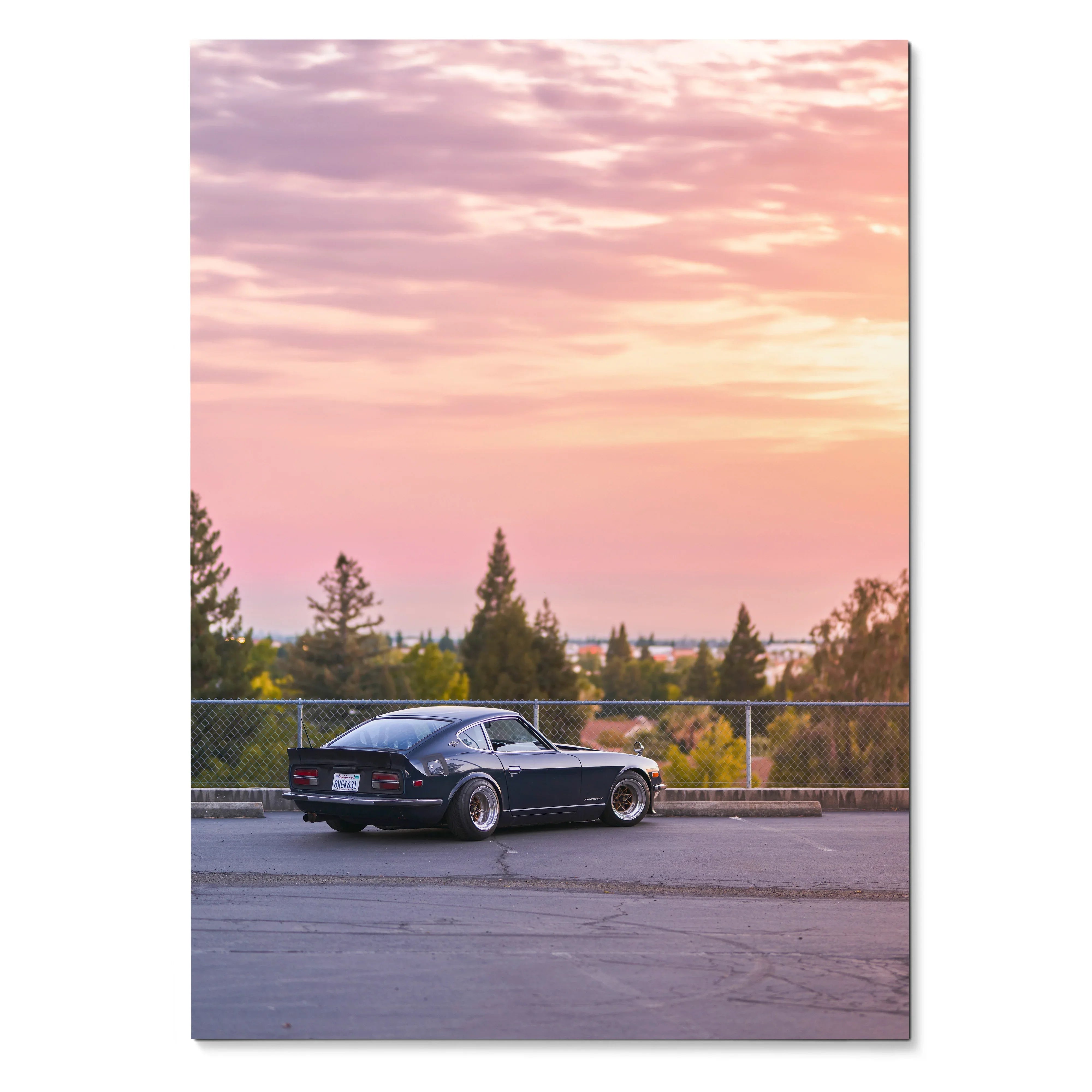 Nissan 240z poster with black classic car against pastel sunset sky wall art.