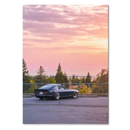 Nissan 240z poster with black classic car against pastel sunset sky wall art.