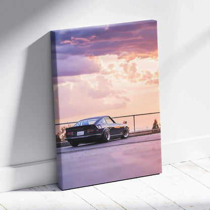 Nissan 240z at sunset on vertical canvas wall art with vibrant sky and detailed car silhouette.