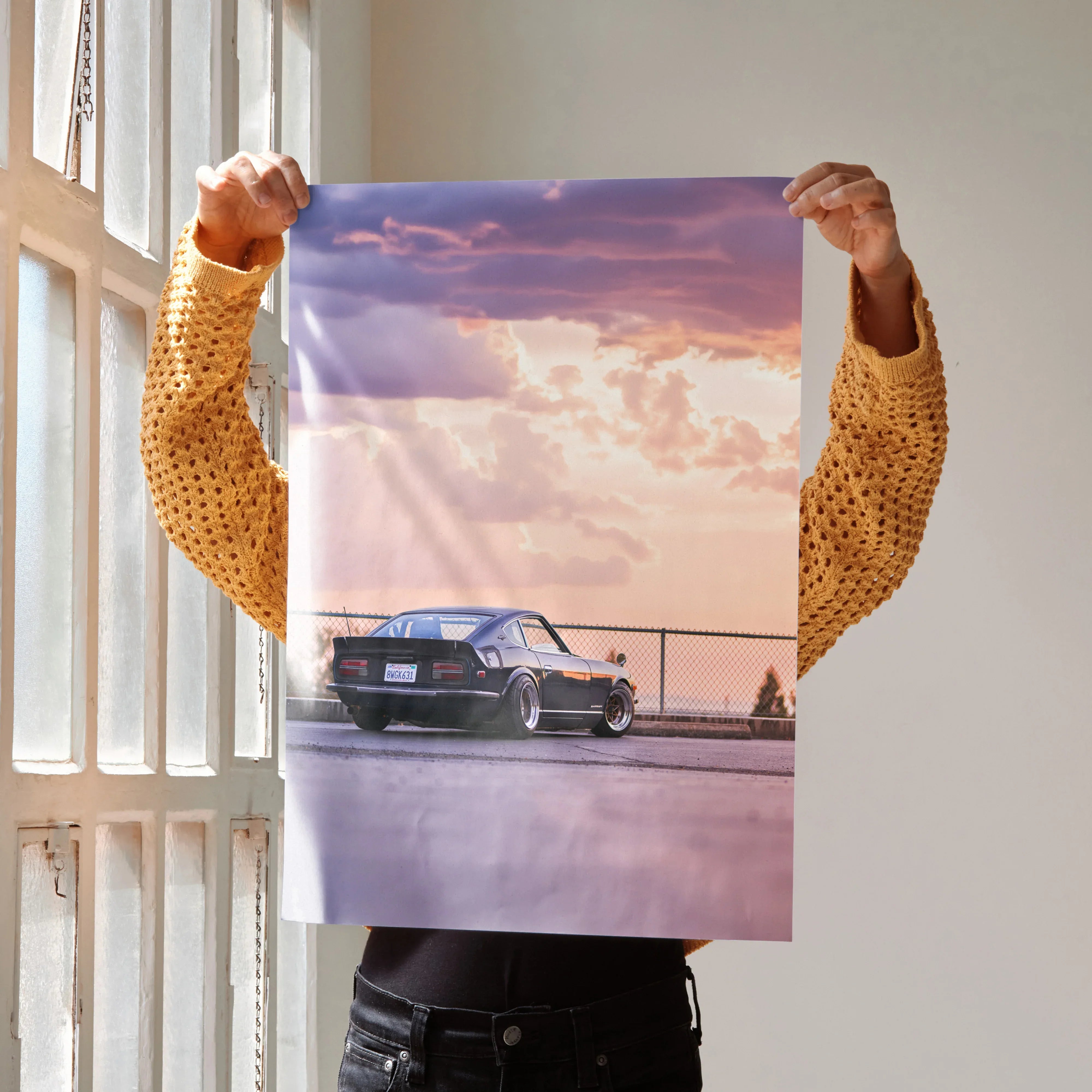 Nissan 240z poster showing classic car with sunset sky, vibrant high-resolution wall art.