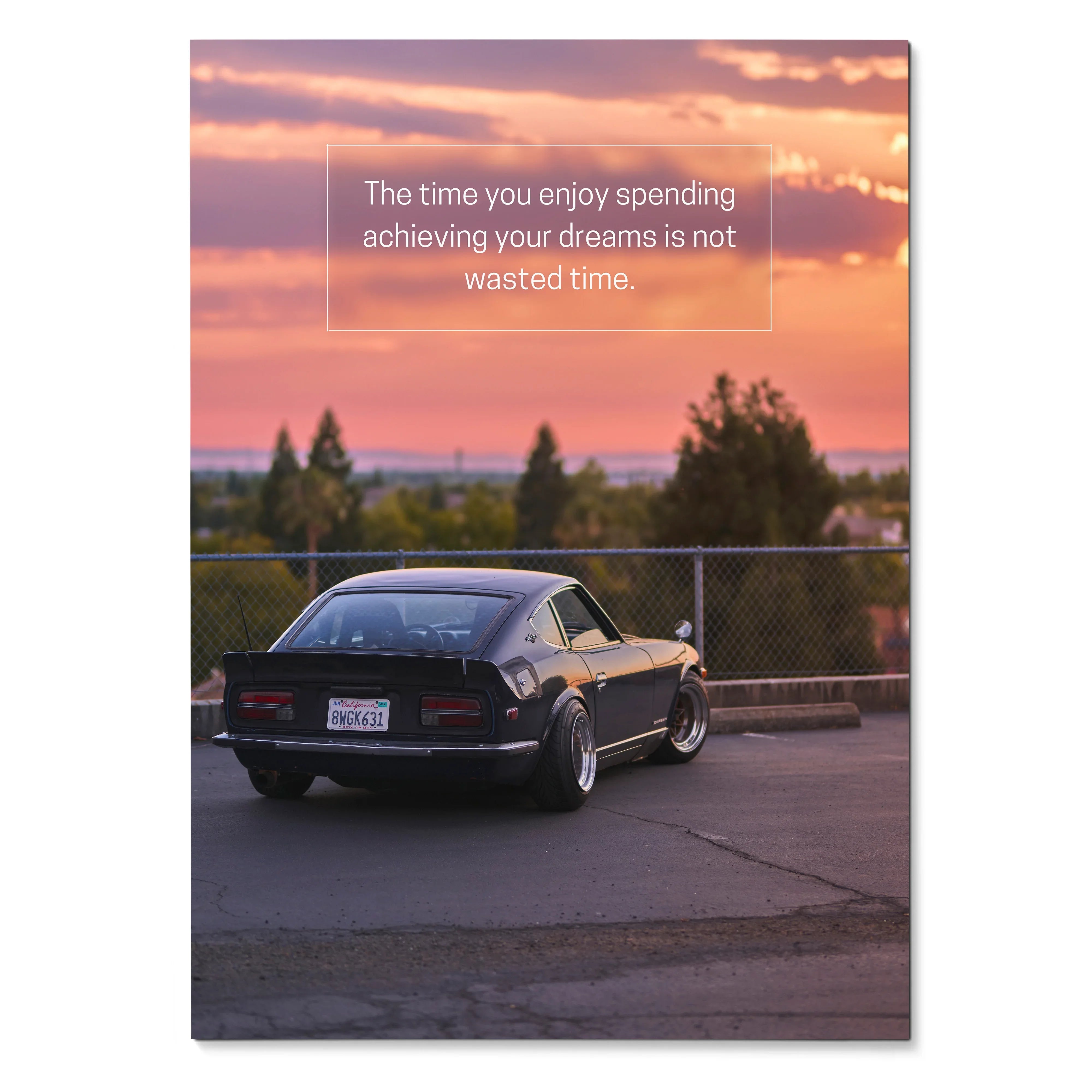 Motivational poster wall art featuring a black Nissan 240z with sunset sky and inspiring text.