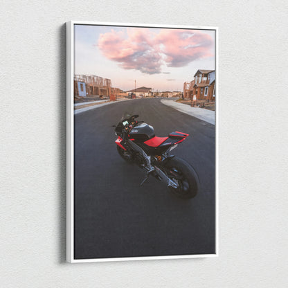 Aprilia RSV4 1100 Factory motorcycle on road under pink sky vertical canvas wall art.