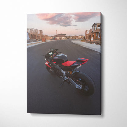 Aprilia RSV4 1100 Factory motorcycle canvas art showing red and black bike on empty street at sunset, vertical wall art.