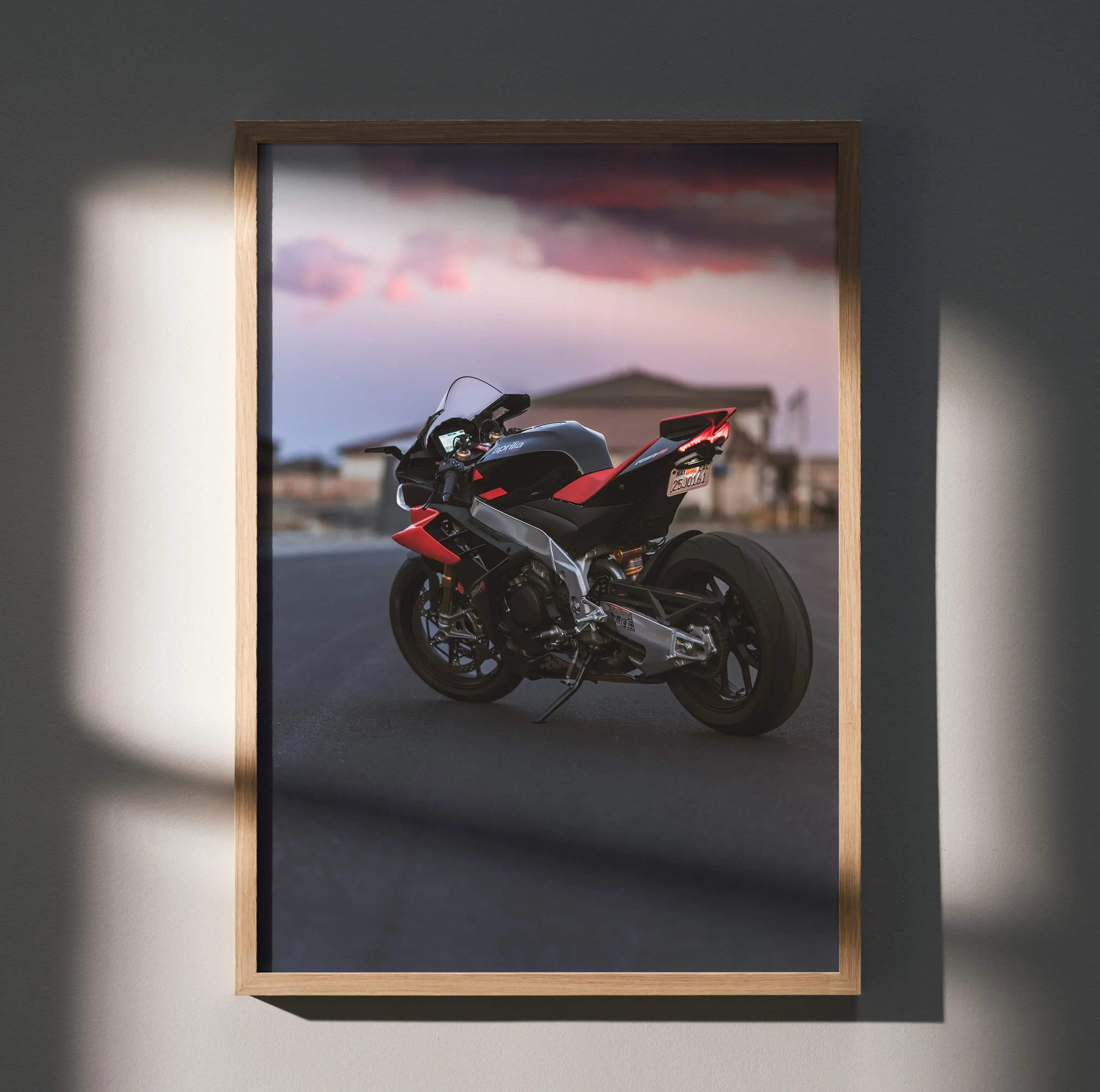 Aprilia RSV4 1100 Factory black and red motorcycle poster wall art with sunset background in wood frame.