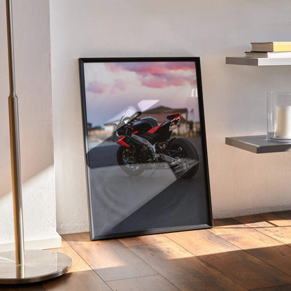 Aprilia RSV4 1100 Factory motorcycle poster with red and black bike against sunset sky wall art.