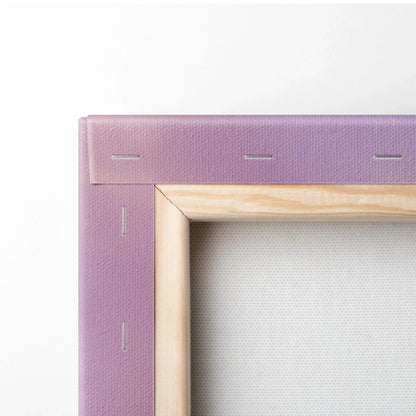 Close-up of wooden frame corner and purple canvas fabric with visible staples for wall art canvas print.