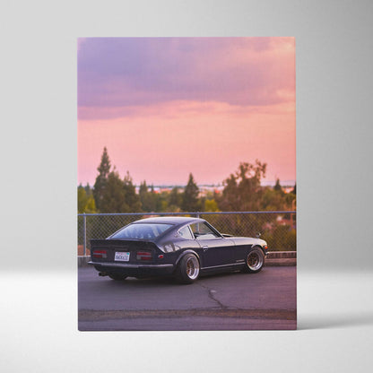 Vertical canvas wall art featuring a black Nissan 240z against a pink sunset sky.