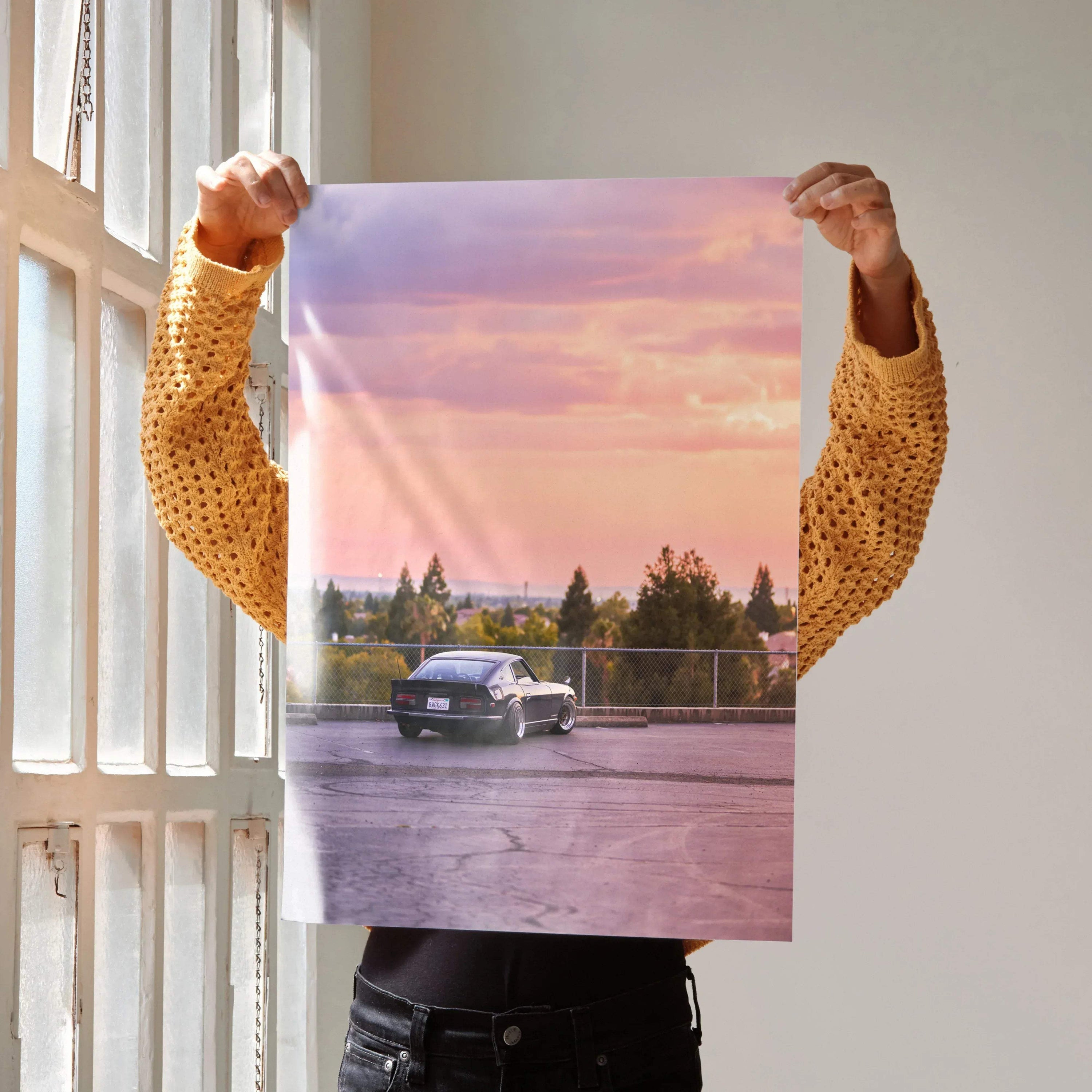Nissan 240z parked at sunset with pink and purple sky, high-resolution car poster wall art.