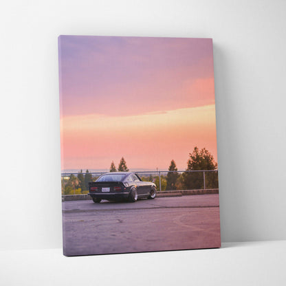 Nissan 240z parked at sunset with pink sky on vertical canvas wall art print.