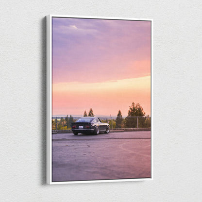 Nissan 240z parked on rooftop during purple and orange sunset canvas wall art.