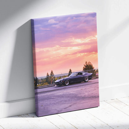 Vertical canvas art featuring a black Nissan 240z parked at sunset with a colorful sky background.