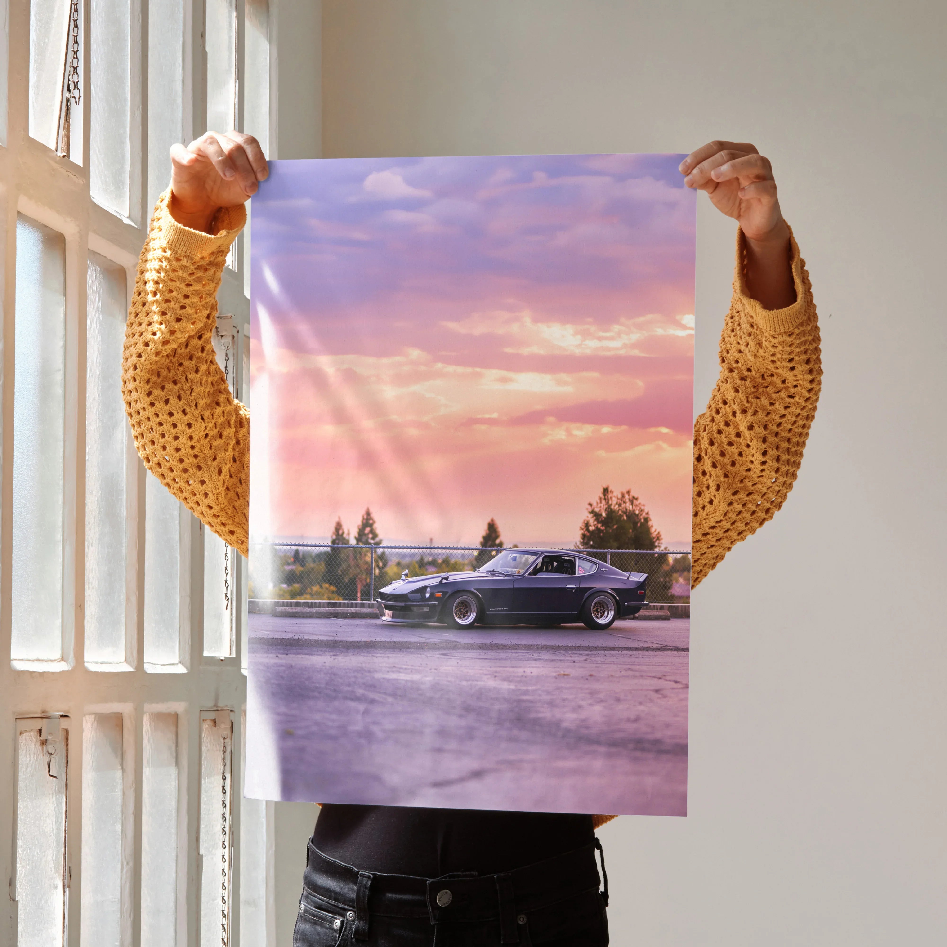 Nissan 240z car parked at sunset, high-resolution poster wall art with purple and orange sky background.