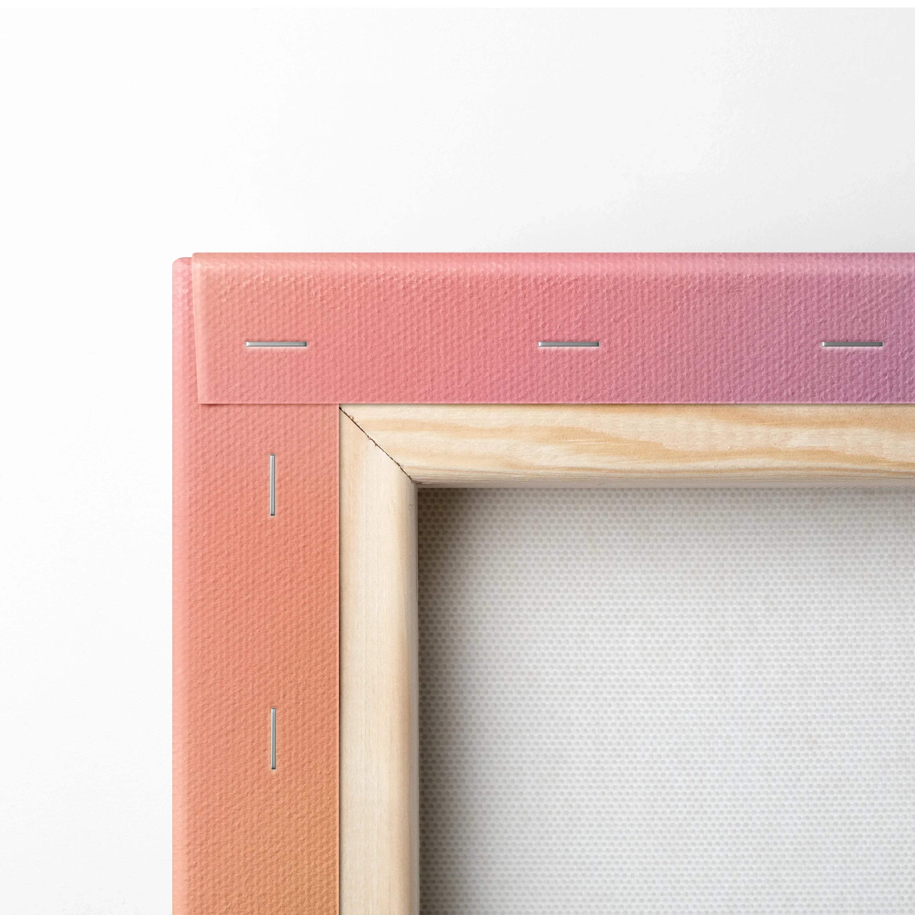 Close-up of wooden frame corner with pink painted canvas stretched and stapled, canvas wall art detail.