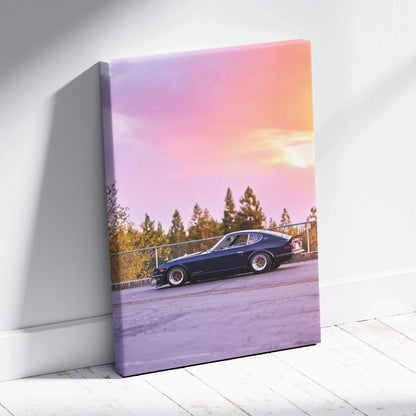 Nissan 240z parked on road under purple and orange sunset sky canvas wall art.