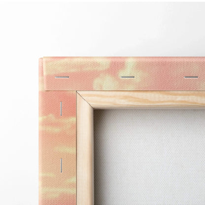 Close-up of stretched canvas with wooden frame and abstract warm sunset colors for wall art.