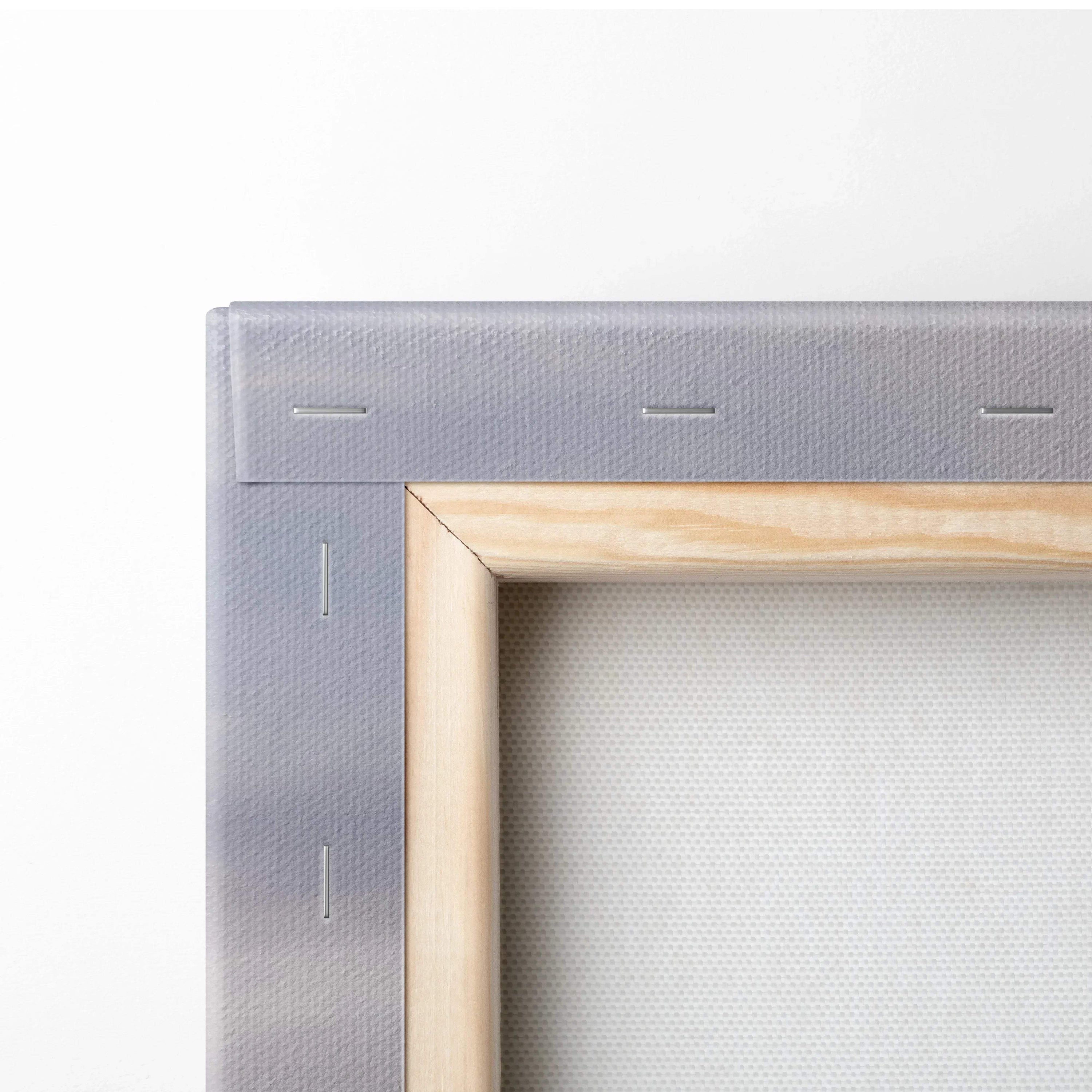 Corner of vertical canvas art with wooden stretcher frame and gray backing, museum-quality wall art canvas.
